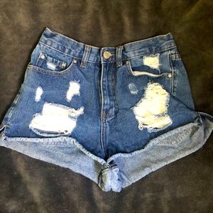 High rise ripped denim shorts.